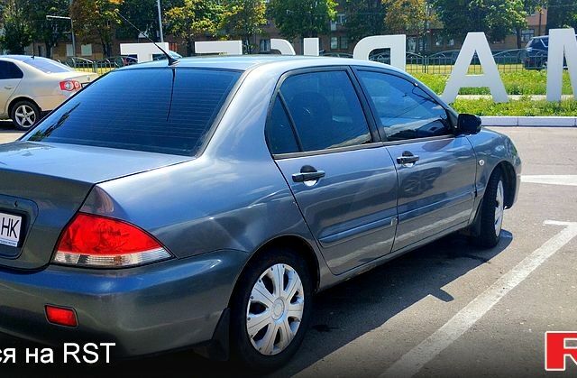 Сірий Міцубісі Lancer, об'ємом двигуна 1.6 л та пробігом 214 тис. км за 3800 $, фото 1 на Automoto.ua