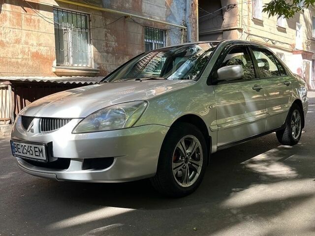 Сірий Міцубісі Lancer, об'ємом двигуна 1.58 л та пробігом 266 тис. км за 3800 $, фото 1 на Automoto.ua