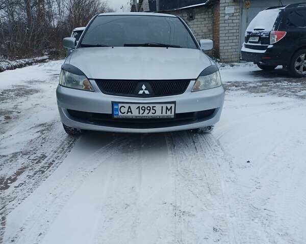 Сірий Міцубісі Lancer, об'ємом двигуна 1.58 л та пробігом 260 тис. км за 2800 $, фото 1 на Automoto.ua