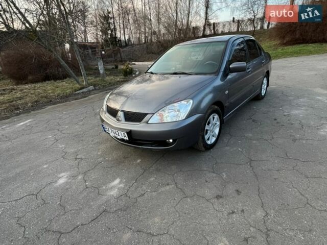 Серый Мицубиси Лансер, объемом двигателя 1.58 л и пробегом 303 тыс. км за 4700 $, фото 1 на Automoto.ua