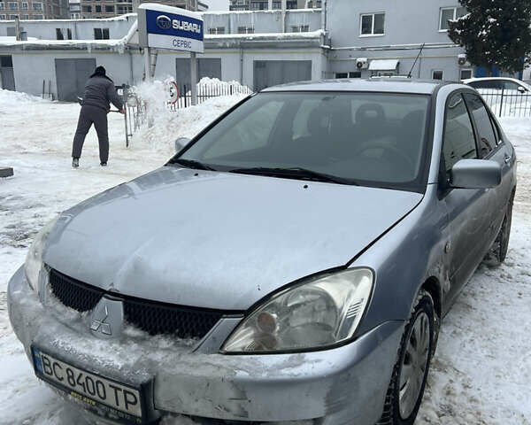 Серый Мицубиси Лансер, объемом двигателя 1.6 л и пробегом 122 тыс. км за 3900 $, фото 1 на Automoto.ua