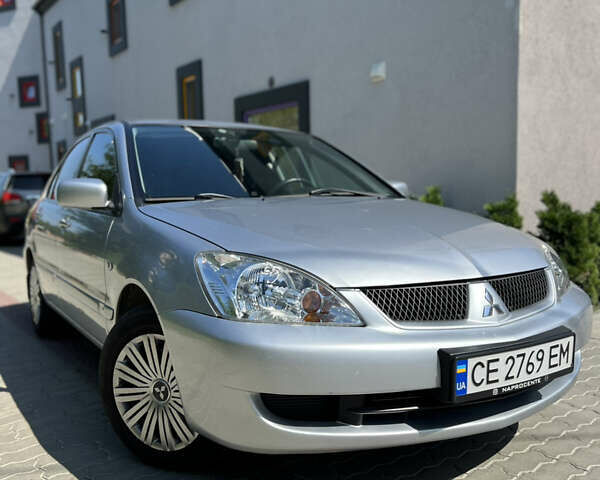 Сірий Міцубісі Lancer, об'ємом двигуна 1.6 л та пробігом 99 тис. км за 3999 $, фото 1 на Automoto.ua