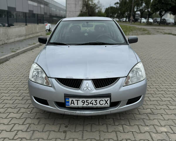 Серый Мицубиси Лансер, объемом двигателя 1.58 л и пробегом 220 тыс. км за 3500 $, фото 1 на Automoto.ua