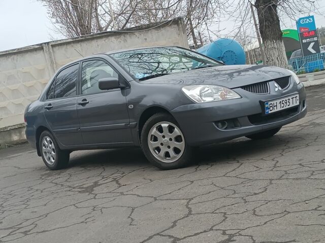 Серый Мицубиси Лансер, объемом двигателя 1.6 л и пробегом 242 тыс. км за 4600 $, фото 1 на Automoto.ua