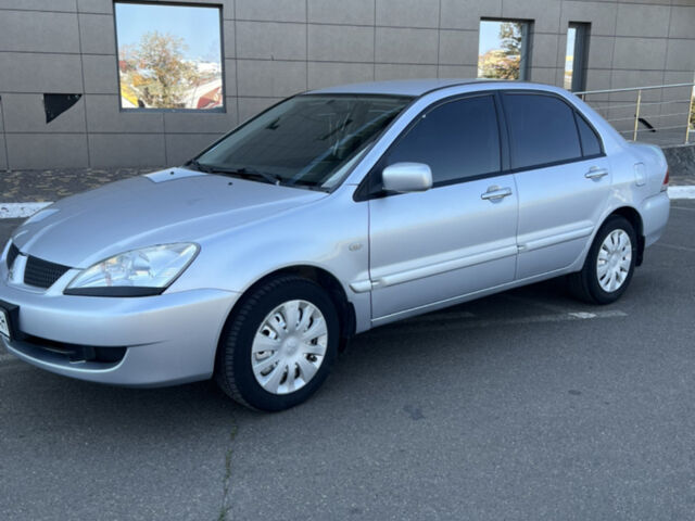 Сірий Міцубісі Lancer, об'ємом двигуна 1.58 л та пробігом 118 тис. км за 4200 $, фото 1 на Automoto.ua