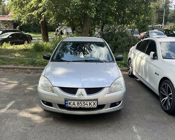 Серый Мицубиси Лансер, объемом двигателя 1.6 л и пробегом 210 тыс. км за 4500 $, фото 1 на Automoto.ua