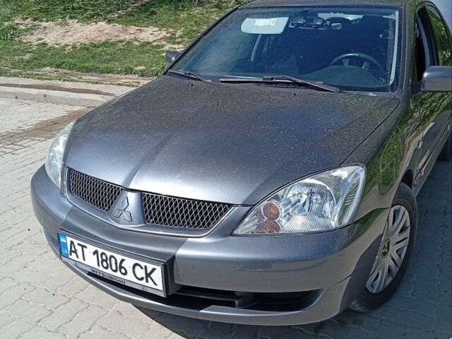 Сірий Міцубісі Lancer, об'ємом двигуна 1.58 л та пробігом 200 тис. км за 4800 $, фото 1 на Automoto.ua