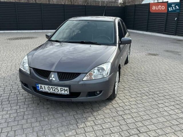 Сірий Міцубісі Lancer, об'ємом двигуна 1.58 л та пробігом 220 тис. км за 4500 $, фото 1 на Automoto.ua