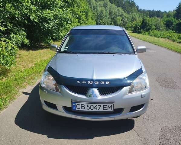 Сірий Міцубісі Lancer, об'ємом двигуна 1.58 л та пробігом 130 тис. км за 4600 $, фото 1 на Automoto.ua