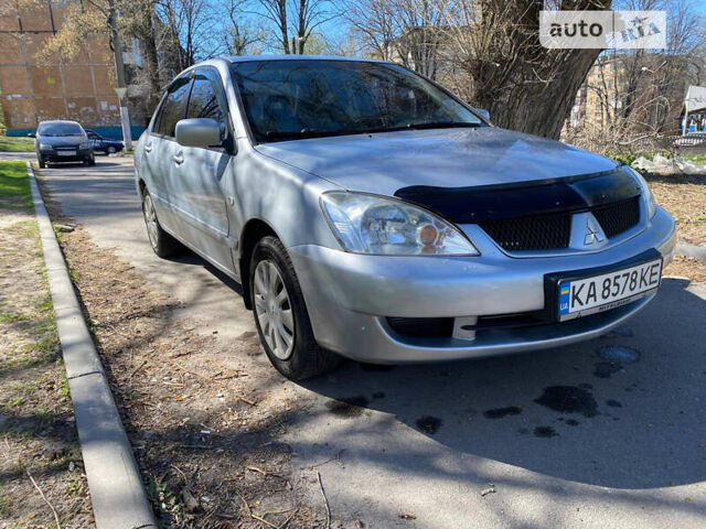 Сірий Міцубісі Lancer, об'ємом двигуна 1.6 л та пробігом 228 тис. км за 3999 $, фото 1 на Automoto.ua