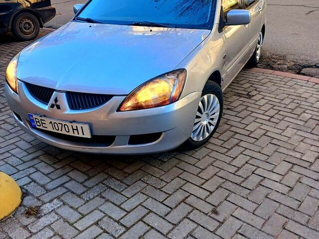 Серый Мицубиси Лансер, объемом двигателя 1.6 л и пробегом 171 тыс. км за 3200 $, фото 1 на Automoto.ua