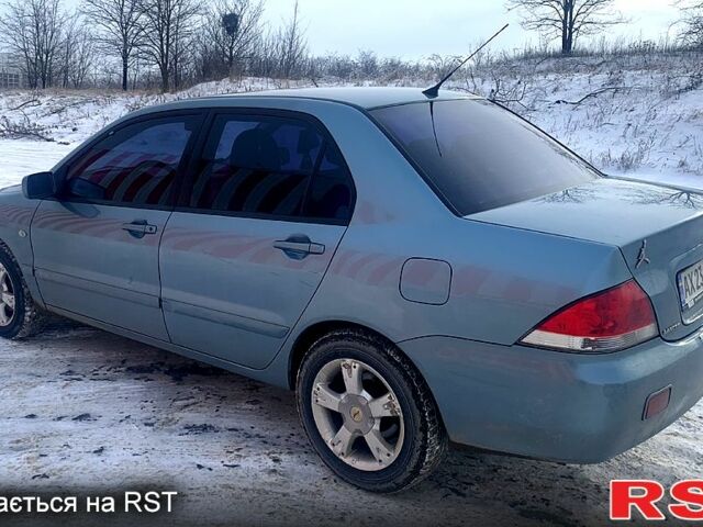 Серый Мицубиси Лансер, объемом двигателя 1.6 л и пробегом 139 тыс. км за 5000 $, фото 1 на Automoto.ua