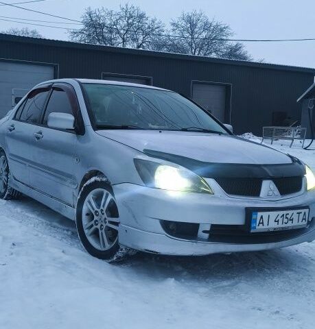 Серый Мицубиси Лансер, объемом двигателя 2 л и пробегом 231 тыс. км за 3100 $, фото 1 на Automoto.ua