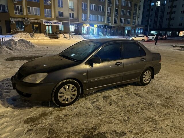 Сірий Міцубісі Lancer, об'ємом двигуна 1.6 л та пробігом 292 тис. км за 4200 $, фото 1 на Automoto.ua