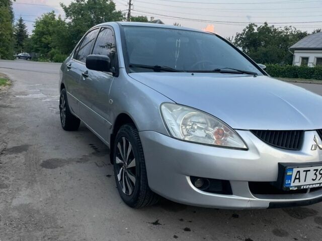Сірий Міцубісі Lancer, об'ємом двигуна 1.58 л та пробігом 190 тис. км за 2800 $, фото 1 на Automoto.ua