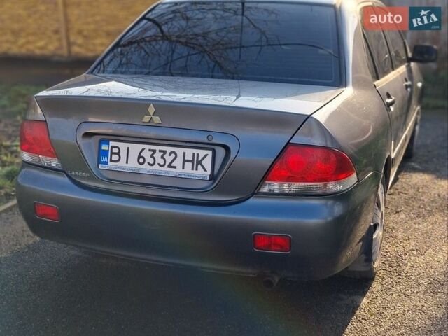 Серый Мицубиси Лансер, объемом двигателя 1.58 л и пробегом 217 тыс. км за 2800 $, фото 1 на Automoto.ua