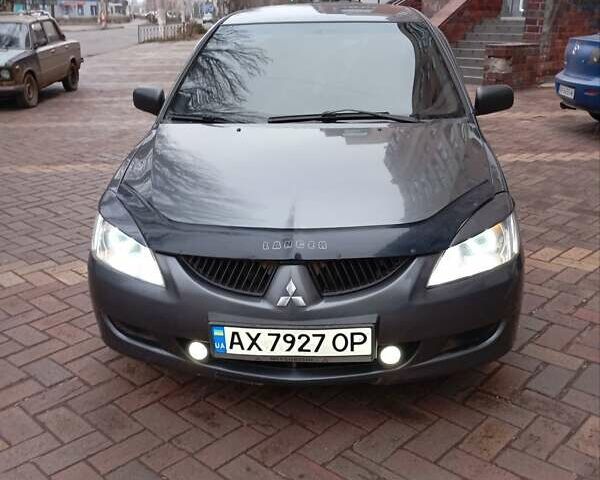 Серый Мицубиси Лансер, объемом двигателя 1.58 л и пробегом 275 тыс. км за 4500 $, фото 1 на Automoto.ua