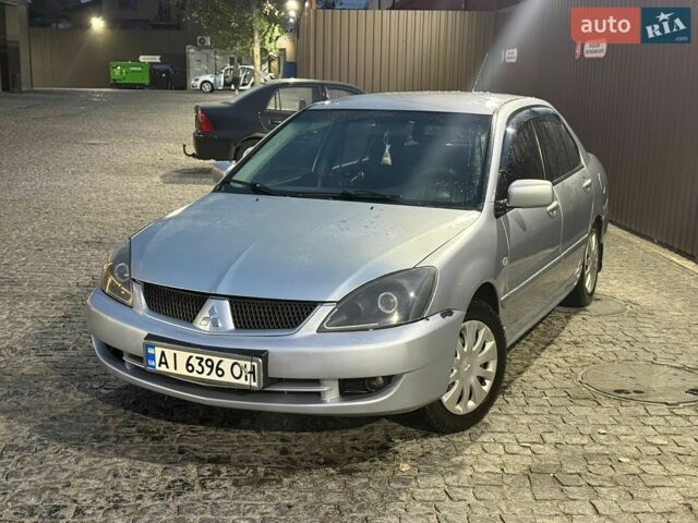 Сірий Міцубісі Lancer, об'ємом двигуна 1.58 л та пробігом 275 тис. км за 2200 $, фото 1 на Automoto.ua