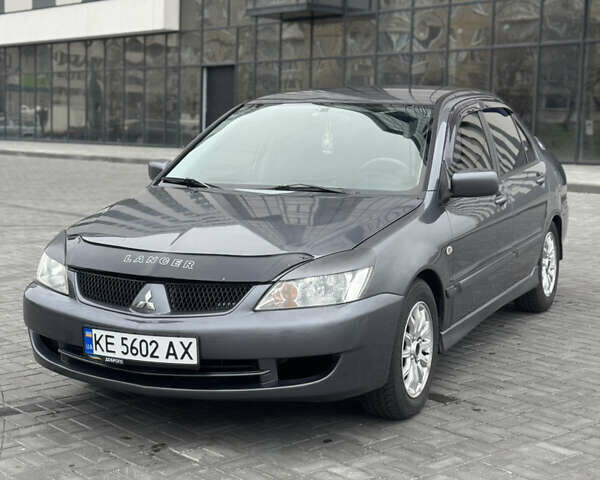 Серый Мицубиси Лансер, объемом двигателя 1.58 л и пробегом 237 тыс. км за 2999 $, фото 1 на Automoto.ua
