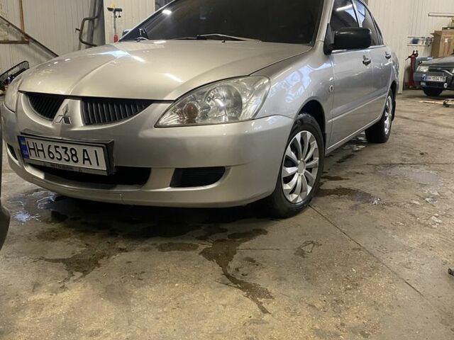 Сірий Міцубісі Lancer, об'ємом двигуна 1.3 л та пробігом 304 тис. км за 3950 $, фото 1 на Automoto.ua