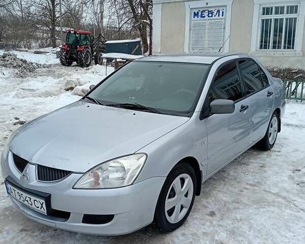 Сірий Міцубісі Lancer, об'ємом двигуна 1.6 л та пробігом 224 тис. км за 4000 $, фото 1 на Automoto.ua