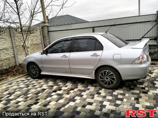 Сірий Міцубісі Lancer, об'ємом двигуна 1.6 л та пробігом 244 тис. км за 5000 $, фото 1 на Automoto.ua