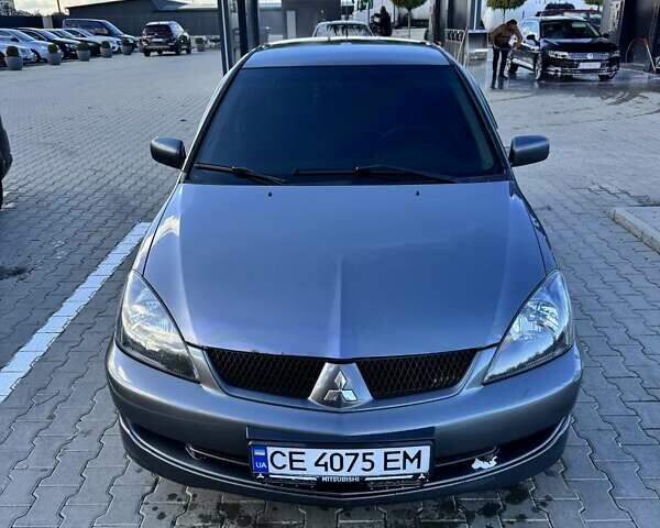 Мицубиси Лансер 2006 в Черновцах на Automoto.ua Серый Мицубиси Лансер, объемом двигателя 1.6 л и пробегом 299 тыс. км за 4300 $, фото 1 на Automoto.ua