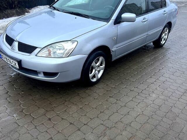 Сірий Міцубісі Lancer, об'ємом двигуна 1.6 л та пробігом 24500 тис. км за 3000 $, фото 1 на Automoto.ua