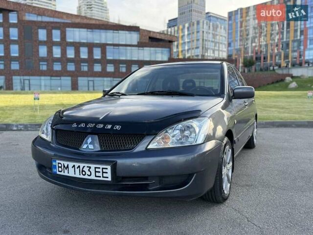 Сірий Міцубісі Lancer, об'ємом двигуна 1.58 л та пробігом 267 тис. км за 3999 $, фото 1 на Automoto.ua