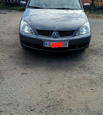 Серый Мицубиси Лансер, объемом двигателя 1.6 л и пробегом 275 тыс. км за 4700 $, фото 1 на Automoto.ua
