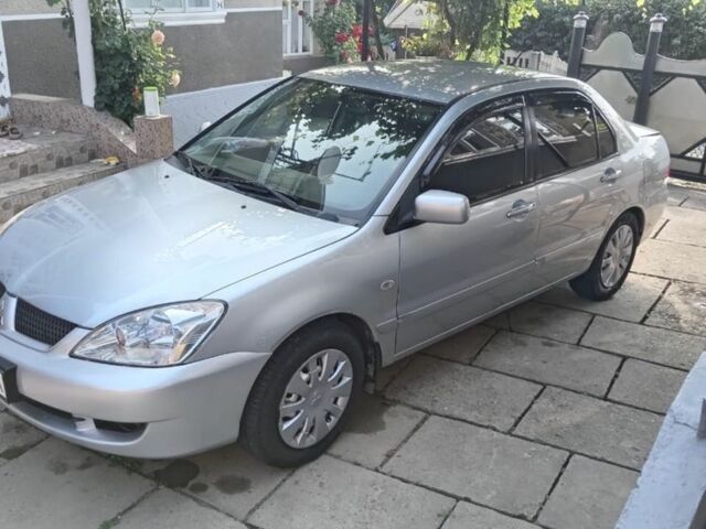 Сірий Міцубісі Lancer, об'ємом двигуна 1.6 л та пробігом 188 тис. км за 4000 $, фото 1 на Automoto.ua
