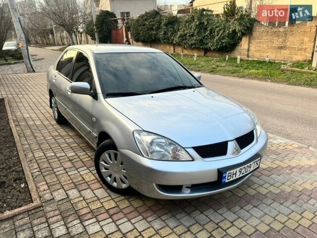 Серый Мицубиси Лансер, объемом двигателя 1.6 л и пробегом 154 тыс. км за 4500 $, фото 1 на Automoto.ua