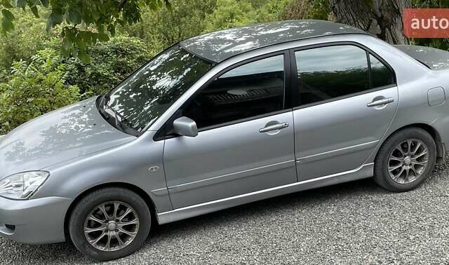 Сірий Міцубісі Lancer, об'ємом двигуна 1.6 л та пробігом 123 тис. км за 7900 $, фото 1 на Automoto.ua
