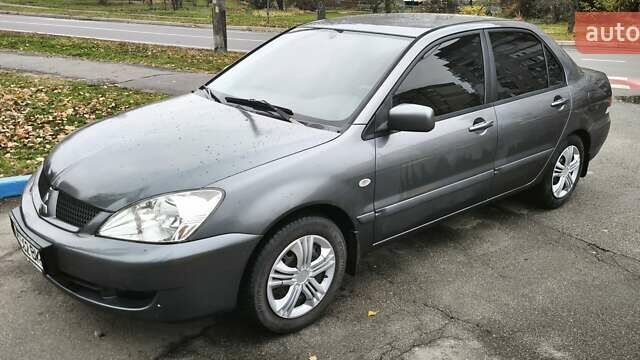 Серый Мицубиси Лансер, объемом двигателя 1.6 л и пробегом 263 тыс. км за 3800 $, фото 1 на Automoto.ua