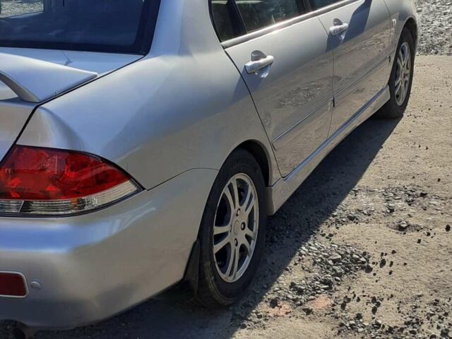 Сірий Міцубісі Lancer, об'ємом двигуна 1.58 л та пробігом 305 тис. км за 3800 $, фото 1 на Automoto.ua
