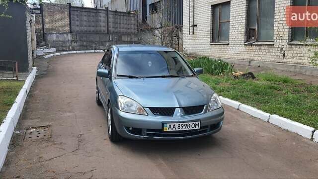 Сірий Міцубісі Lancer, об'ємом двигуна 1.58 л та пробігом 169 тис. км за 4340 $, фото 1 на Automoto.ua