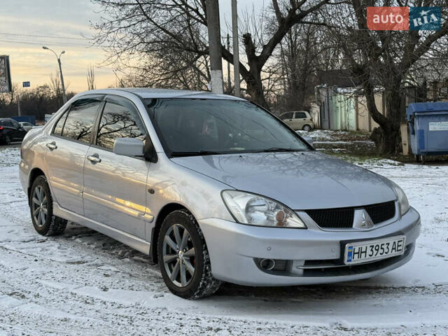 Серый Мицубиси Лансер, объемом двигателя 1.58 л и пробегом 244 тыс. км за 4800 $, фото 1 на Automoto.ua
