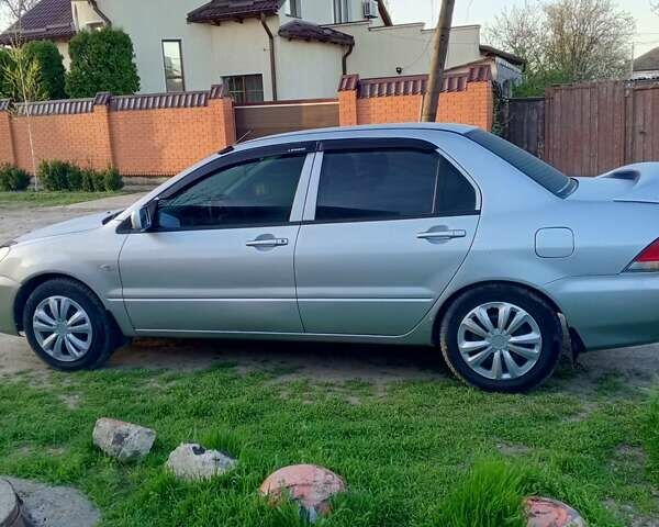 Сірий Міцубісі Lancer, об'ємом двигуна 1.59 л та пробігом 217 тис. км за 4600 $, фото 1 на Automoto.ua