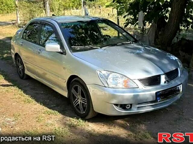 Серый Мицубиси Лансер, объемом двигателя 1.6 л и пробегом 227 тыс. км за 4400 $, фото 1 на Automoto.ua