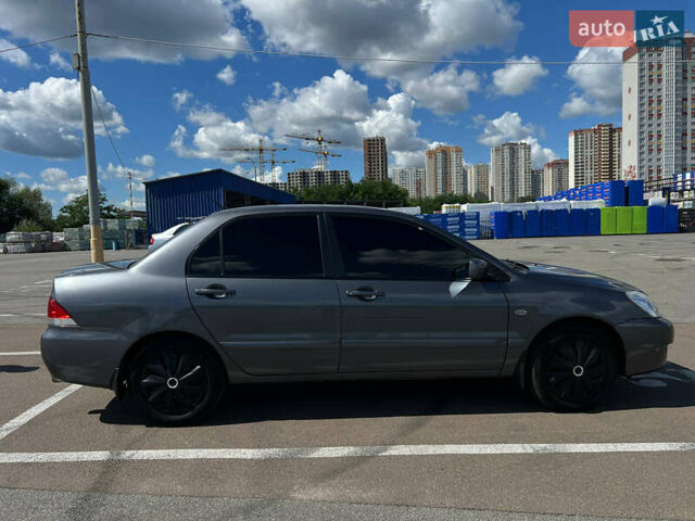 Сірий Міцубісі Lancer, об'ємом двигуна 1.6 л та пробігом 223 тис. км за 4500 $, фото 1 на Automoto.ua