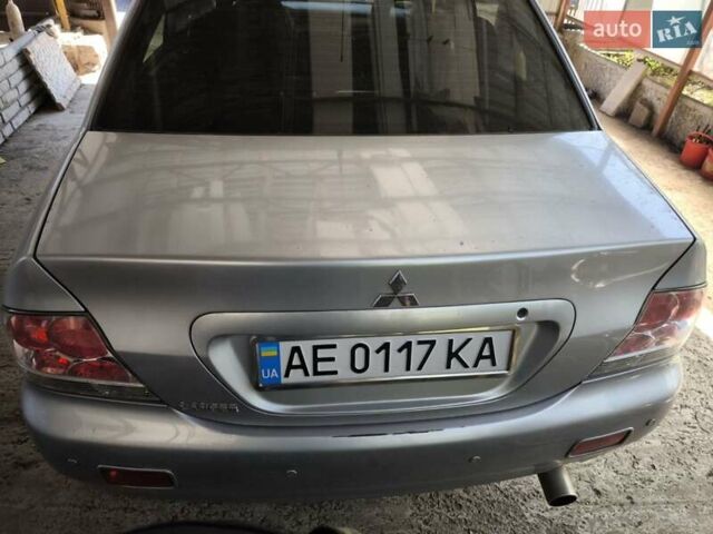 Сірий Міцубісі Lancer, об'ємом двигуна 1.58 л та пробігом 186 тис. км за 4300 $, фото 1 на Automoto.ua