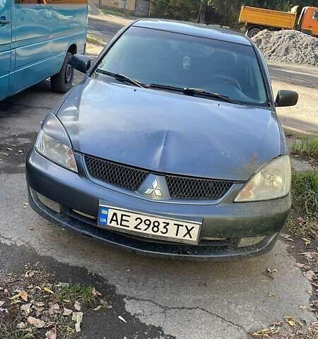 Серый Мицубиси Лансер, объемом двигателя 1.6 л и пробегом 250 тыс. км за 4500 $, фото 1 на Automoto.ua