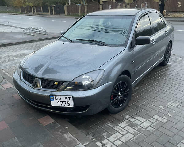 Сірий Міцубісі Lancer, об'ємом двигуна 1.6 л та пробігом 244 тис. км за 2999 $, фото 1 на Automoto.ua