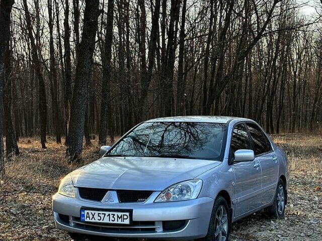 Серый Мицубиси Лансер, объемом двигателя 1.6 л и пробегом 288 тыс. км за 3450 $, фото 1 на Automoto.ua