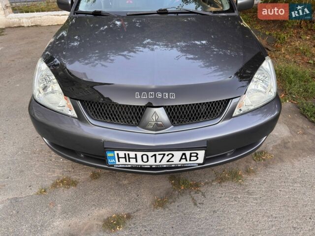 Сірий Міцубісі Lancer, об'ємом двигуна 1.58 л та пробігом 325 тис. км за 4000 $, фото 1 на Automoto.ua