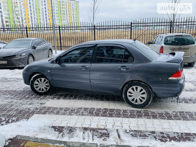 Сірий Міцубісі Lancer, об'ємом двигуна 1.6 л та пробігом 228 тис. км за 4600 $, фото 1 на Automoto.ua