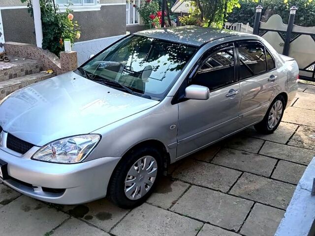 Сірий Міцубісі Lancer, об'ємом двигуна 1.6 л та пробігом 188 тис. км за 4000 $, фото 1 на Automoto.ua