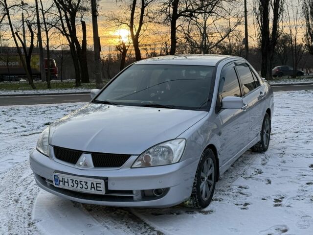 Серый Мицубиси Лансер, объемом двигателя 1.6 л и пробегом 240 тыс. км за 4600 $, фото 1 на Automoto.ua