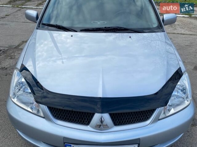 Серый Мицубиси Лансер, объемом двигателя 1.58 л и пробегом 288 тыс. км за 4200 $, фото 1 на Automoto.ua