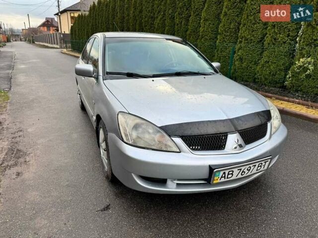 Сірий Міцубісі Lancer, об'ємом двигуна 1.58 л та пробігом 333 тис. км за 2750 $, фото 1 на Automoto.ua